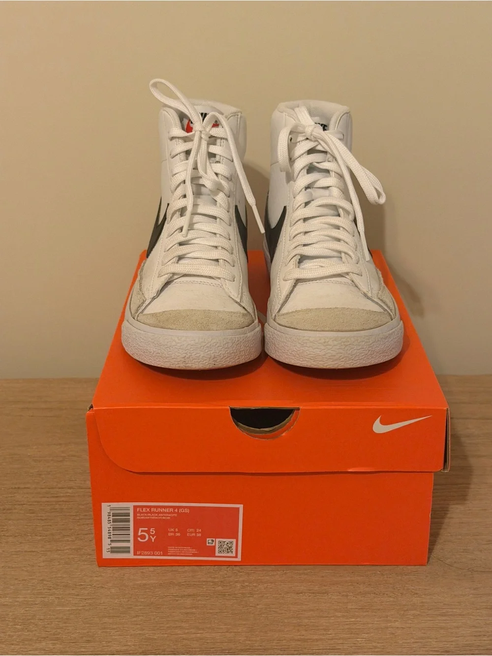 Nike White High-Top Sneakers with Black Swoosh Accent